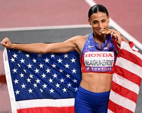The American sprinter clocks speediest women’s 400m in four decades to secure championship title
